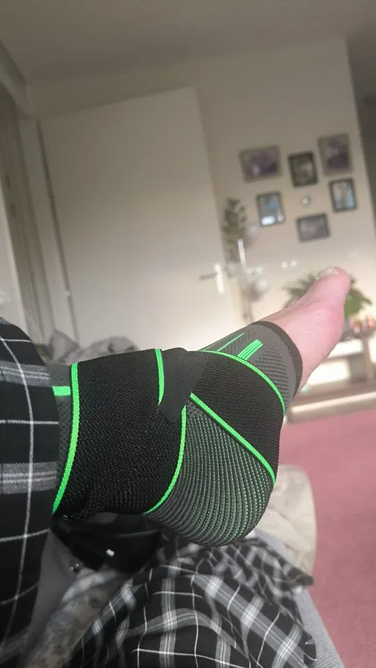 Customer photo: green arch support sleeve worn on foot